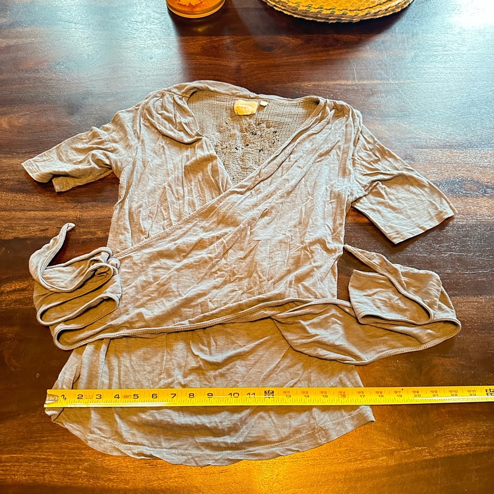 Boho wrap top with mesh decorative backing.